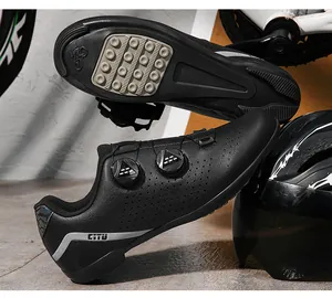Close-up of black cycling shoes with dual rotating buckles and durable sole