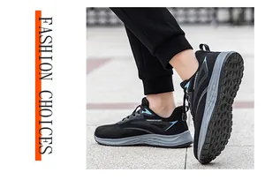 Detail view of men's breathable black mesh walking sneakers in an outdoor setting