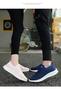 Detail shot of breathable knit slip-on sneakers for men and women in pink and navy blue