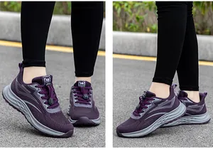 Detail showing breathable purple fly-woven mesh and grey sole of these walking shoes