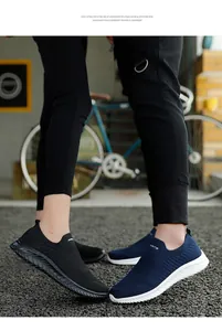 Breathable fly-woven slip-on sock sneakers with lightweight EVA soles for couples.