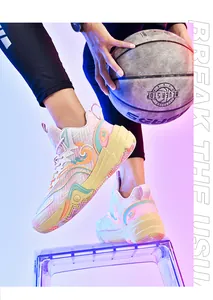 Detailed action shot of colorful mesh basketball sneakers with vibrant neon studio lighting