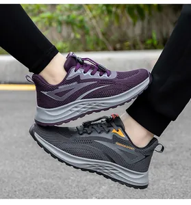 Detail of breathable purple and grey mesh running shoes with 'FASHION SPORT' text.