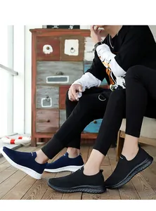 Close-up of breathable fly-woven slip-on sneakers in black and navy blue colors