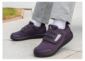 Close-up of the breathable mesh upper and triple velcro straps on purple walking shoes