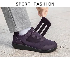 Close-up detail showing the adjustable velcro strap on this purple mesh walking shoe