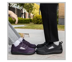 Detailed view of breathable mesh walking shoes with dual Velcro straps in purple and black