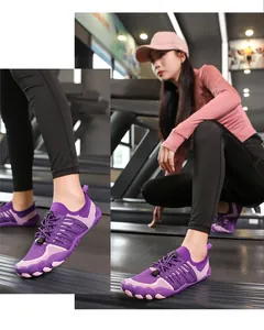 Detail shot of purple breathable mesh water shoes worn by an athletic model in a gym