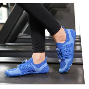 Close-up detail of blue breathable mesh water shoes with fly-knit texture on a treadmill