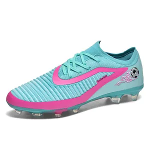 Professional low-top fly-knit soccer shoes with FG/HG studs in vibrant blue and pink