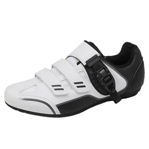 Professional white and black cycling shoes featuring Velcro straps and secure buckle closure