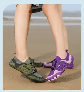 Detailed view of breathable five-toe water shoes for men and women on a sandy beach