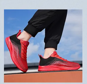 Side view showing the breathable flyknit material of red and black running shoes