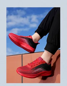 Red and black fly-knit running shoes with breathable mesh upper for outdoor sports