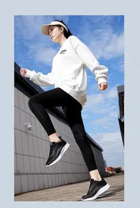 Action shot of breathable flying knit running shoes worn by model outdoors in sunlight