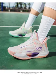 Detail of breathable low-top basketball shoes with pink and green mismatched color design