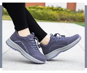 Close-up of purple mesh walking shoes with quick-lace system for outdoor travel