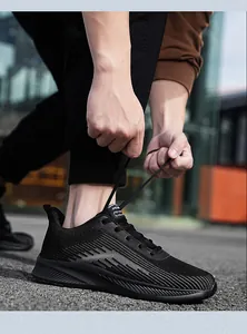 Close-up of black breathable flyknit running shoes with mesh texture for casual sports