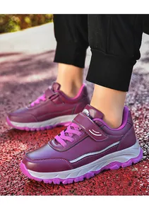 Macro view of purple leather walking shoes with Velcro strap and durable thick sole