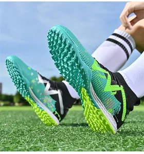 Detailed macro view of vibrant soccer shoe outsole with AG/TF studs on grass turf