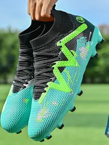 High-top performance soccer cleats in teal and black, featuring AG/FG spikes for outdoor play