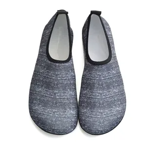 Detailed top view of grey textured elastic mesh water shoes for swimming and yoga