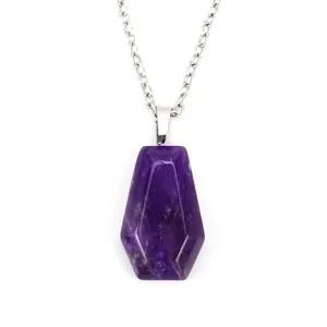 Close-up detail showing the natural texture of a purple crystal coffin shaped pendant