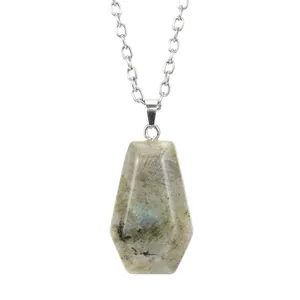 Macro view of coffin-shaped natural labradorite pendant on a silver-tone chain.