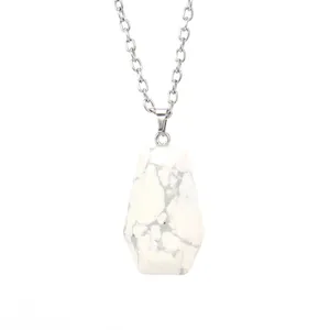 Close-up of a white marble coffin pendant necklace with a fine silver-tone chain.