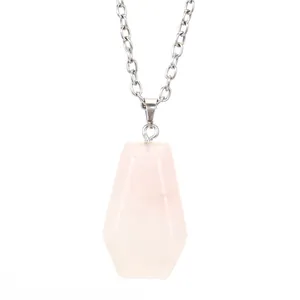 Detailed view of the pink rose quartz coffin pendant with polished facets on a silver chain