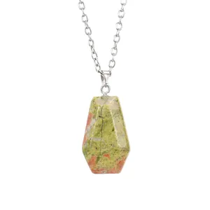 Detail shot of a natural unakite stone coffin pendant on a silver-tone chain necklace.