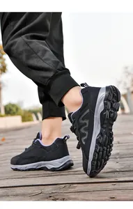 Low-top mesh walking shoes shown in outdoor setting with focus on the rugged sole