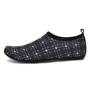 Detailed side view of black and white grid pattern quick-dry water shoes for unisex swimming