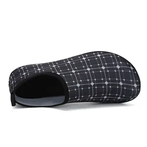 Side view of black water shoes with a geometric grid pattern for swimming and yoga