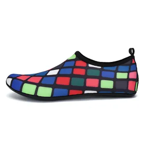 Side view detail of colorful mosaic pattern slip-on water shoes with heel pull tab.
