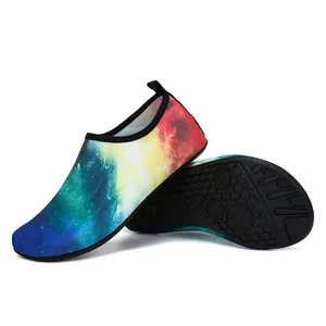 Detailed view of colorful galaxy print aqua shoes with non-slip honeycomb rubber sole