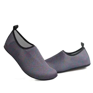 Detailed view of breathable purple striped barefoot aqua shoes with slip-on design