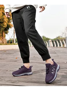 Close-up of purple breathable mesh walking shoes for seniors in outdoor park
