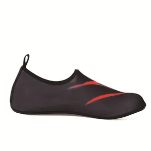Close-up view of a black elastic mesh water shoe with vibrant red graphic design