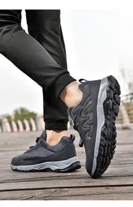 Dynamic outdoor side view of breathable low-top mesh walking shoes on a wooden path