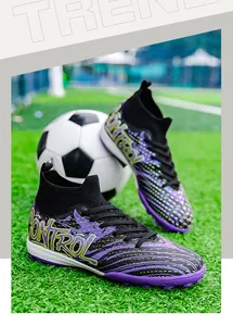 Close-up of purple and black high-top knitted soccer shoes with decorative 'CONTROL' print