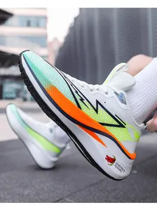 Detail of breathable white mesh running shoes with vibrant orange and green accents