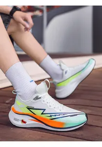 Detailed view of lightweight breathable mesh running shoes in white with neon accents
