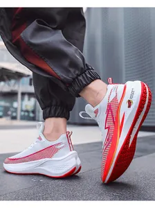 Close-up of white mesh running shoes with red accents and a thick shock-absorbing sole.