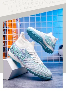 Detailed view of high-top knitted breathable soccer shoes with blue patterns and TF soles