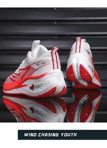 Macro view of lightweight mesh running shoes with red pattern details and shock absorption.
