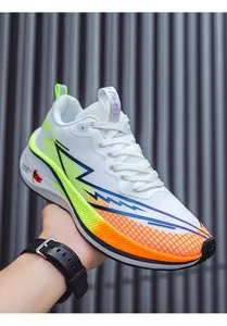 Close-up detail of white mesh running shoes featuring neon orange and green gradient accents