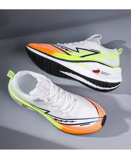 Close-up detail of lightweight white mesh running shoes with a neon orange gradient