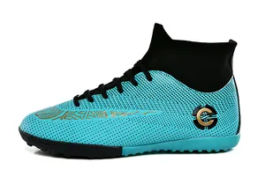Detail of cyan high-top soccer shoe with mesh texture and gold logo on white background.