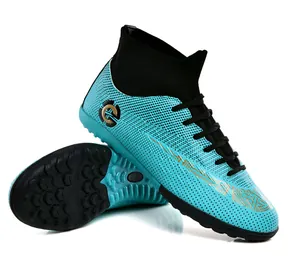 Blue high-top soccer shoes with turf cleats and breathable knit collar for training